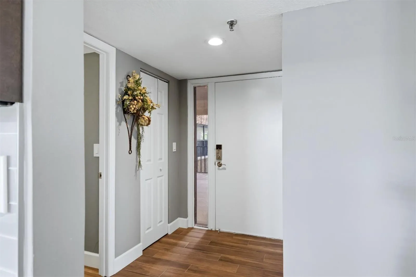 Front Door and Half Bath to the left