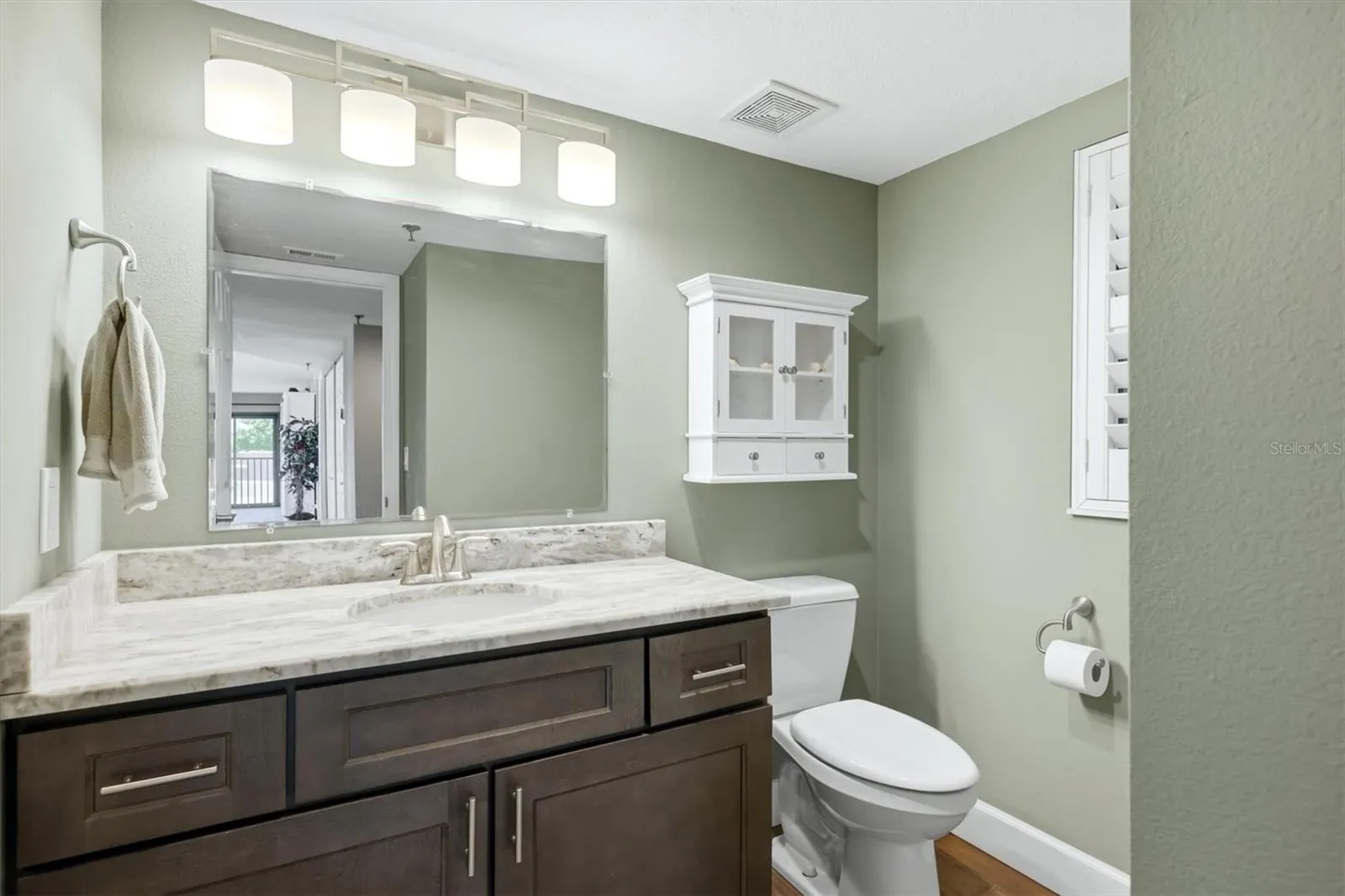 Half Bath with same custom cabinets.