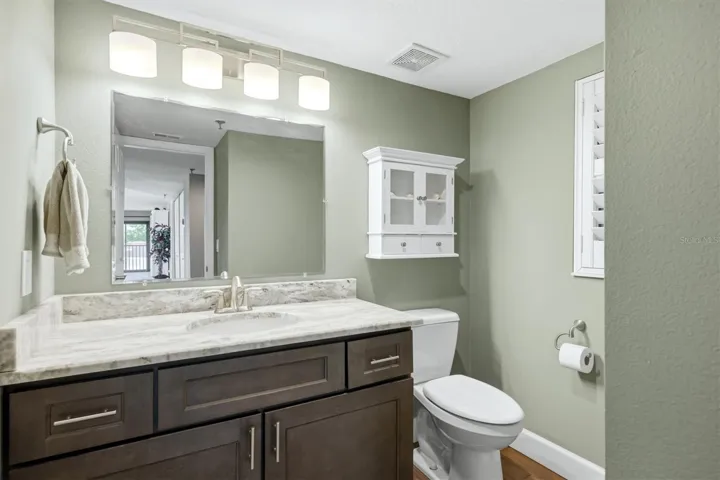 Half Bath with same custom cabinets.
