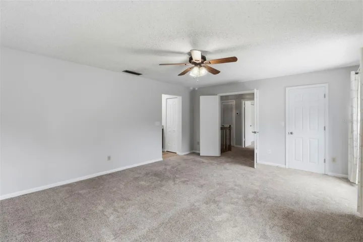 Primary bedroom with double door entry