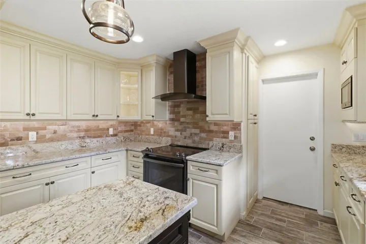 Kitchen - corner lighted cabinet for display