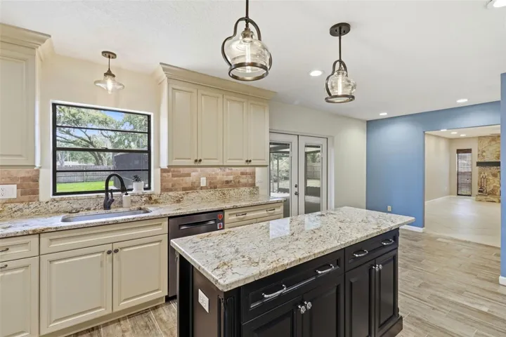 Kitchen looking at breakfast nook and living room