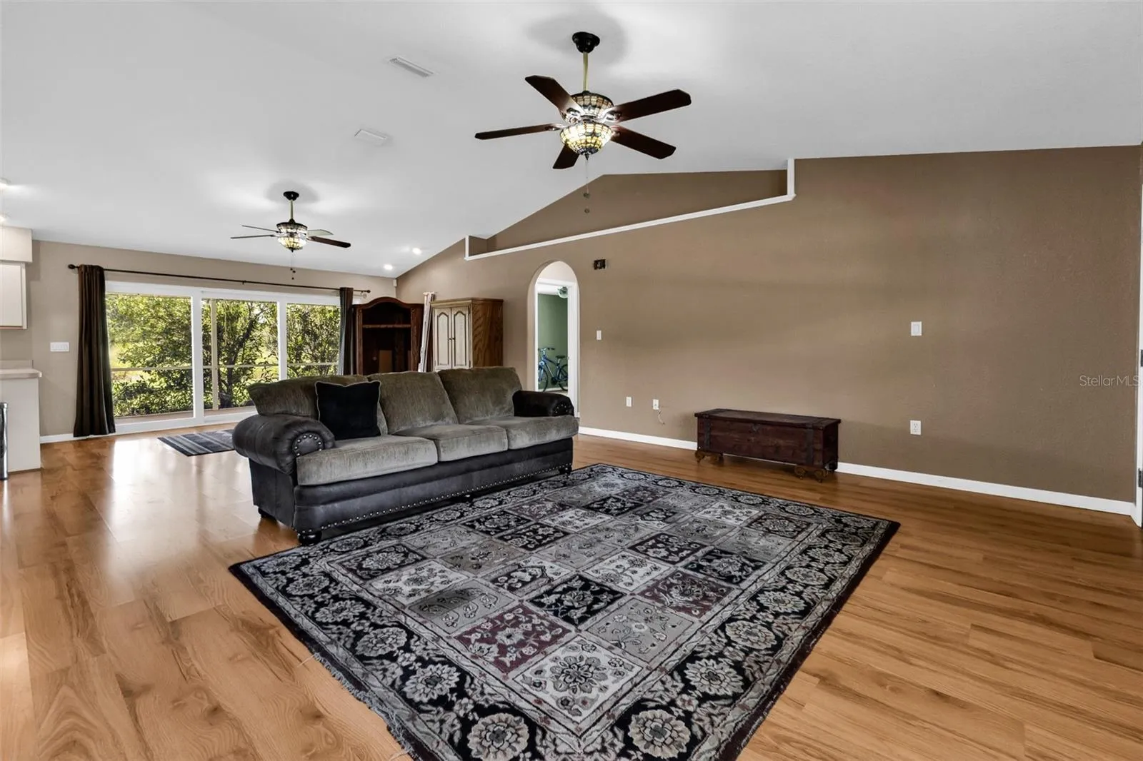 Great room and dinette areas. Hall to both bedrooms and bathroom on right