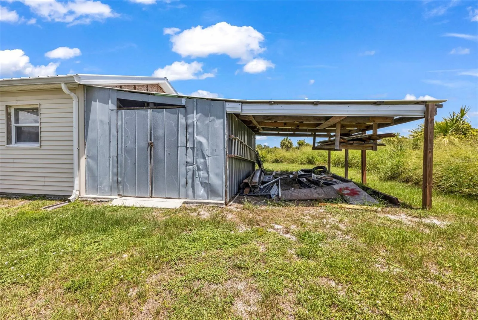Shed and storage area behind detached garage