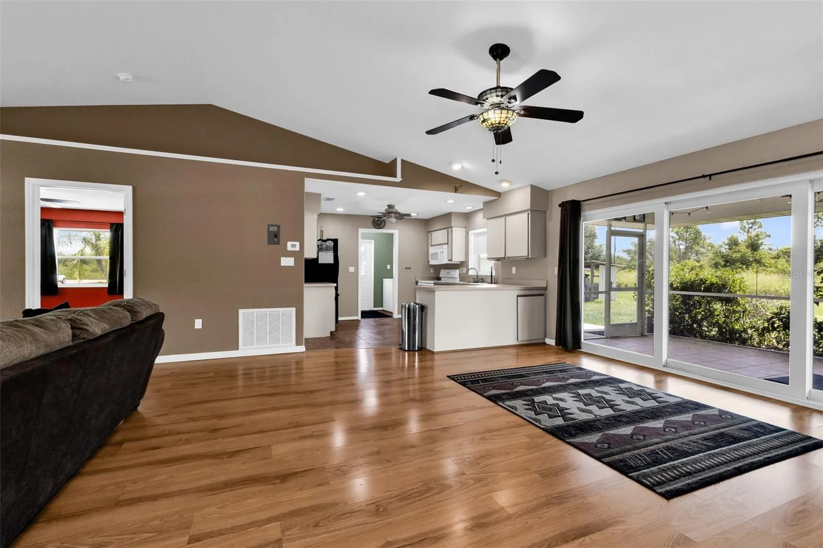 Dinette area, kitchen and primary bedroom on left