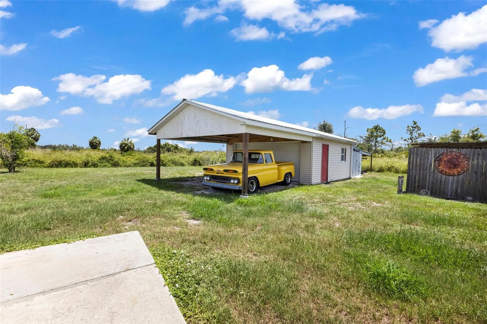 Detached garage with carport