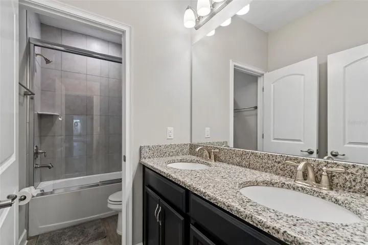 Upstairs bathroom with dual sinks
