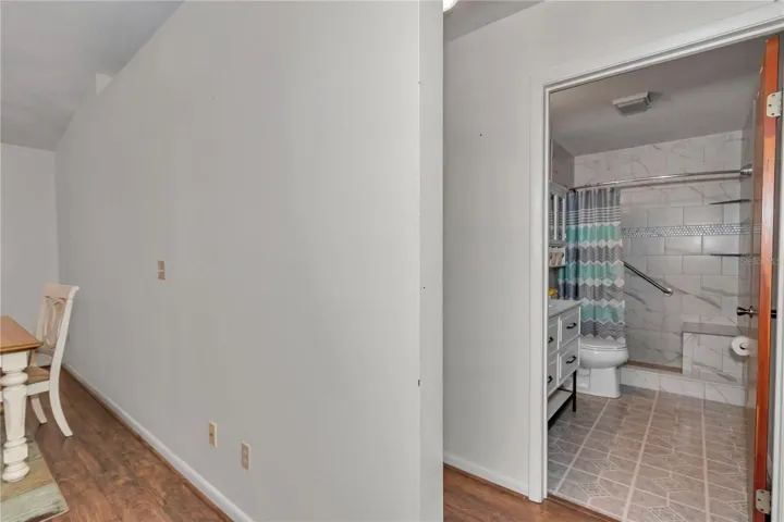 Hallway to guest bath and bed rooms