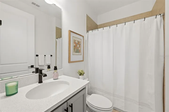 Guest Hall Bath with Quartz counters & bathtub