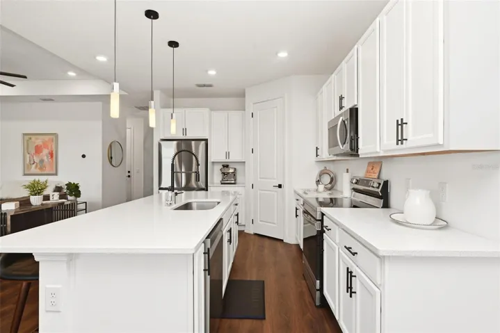 Kitchen is open to Living Room yet away from Front DoorBeverage - Serving Bar Counter