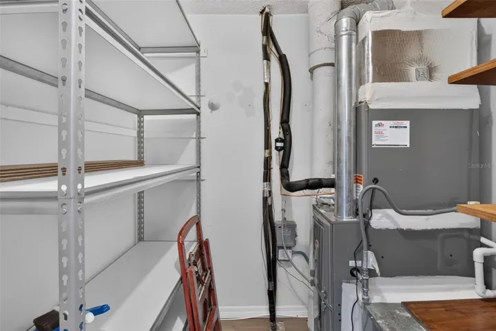 Storage in unit with shelves.