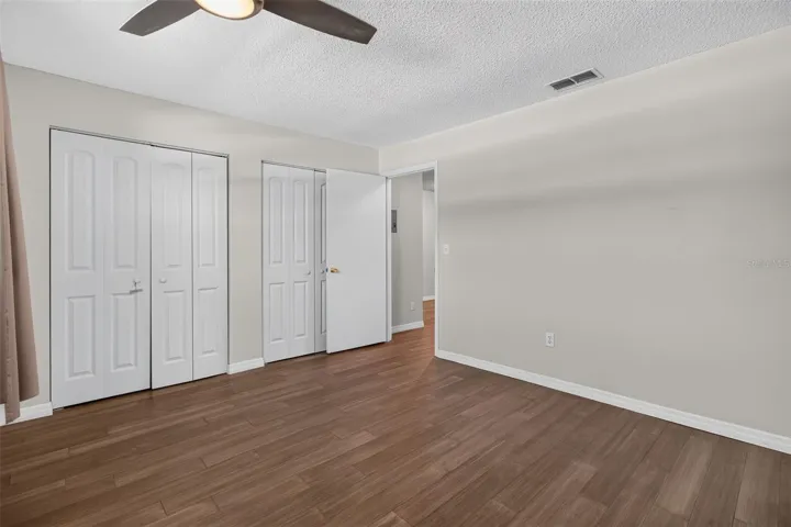 Bedroom with large built in closets.
