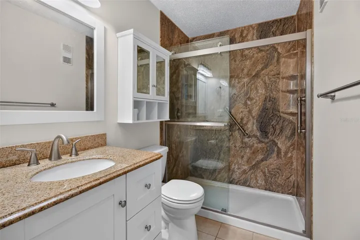 Updated bathroom with new walk in shower.