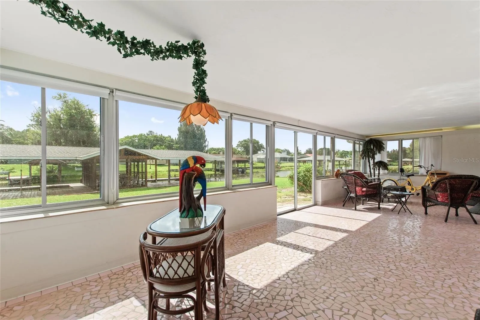Sun room with view of boat house.