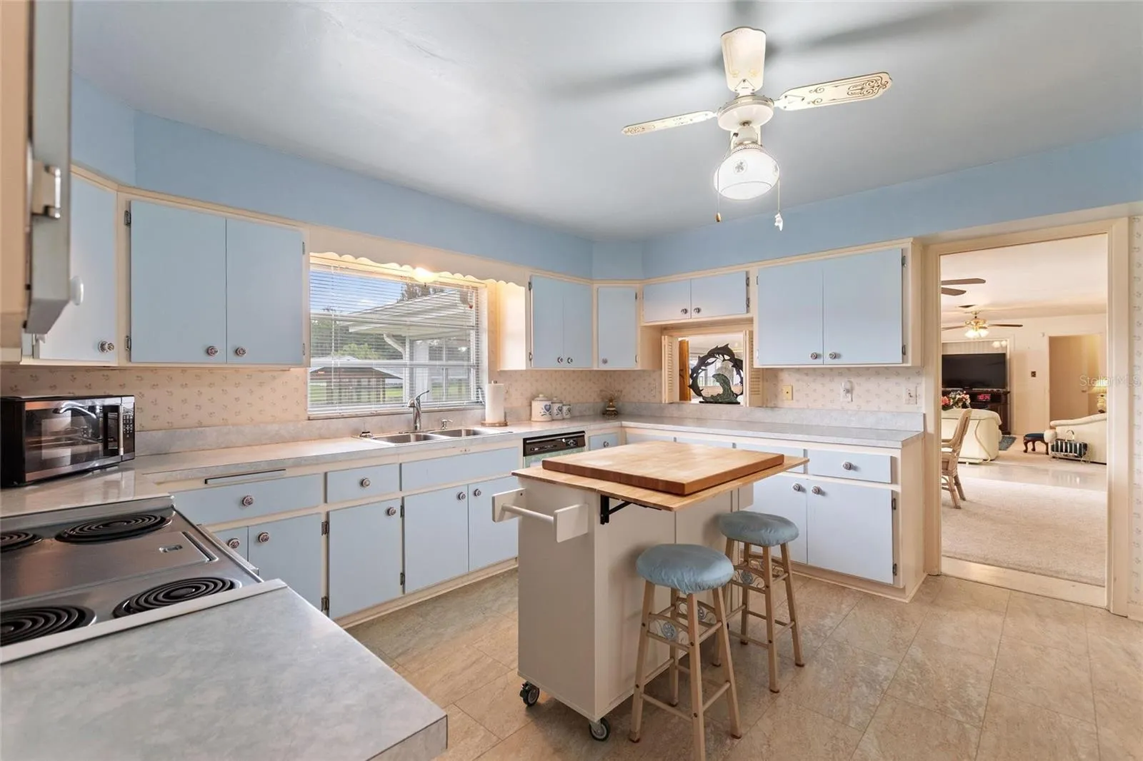 View of kitchen with direct view of informal areas.