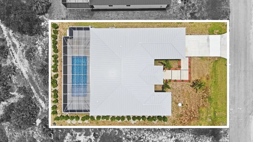 Drone view of home with pool