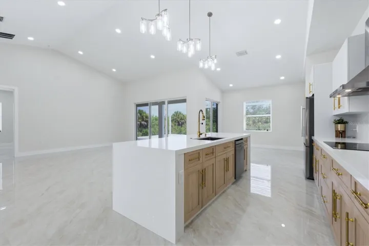 10' Quartz Kitchen Island with wood cabinetry and gold hardware