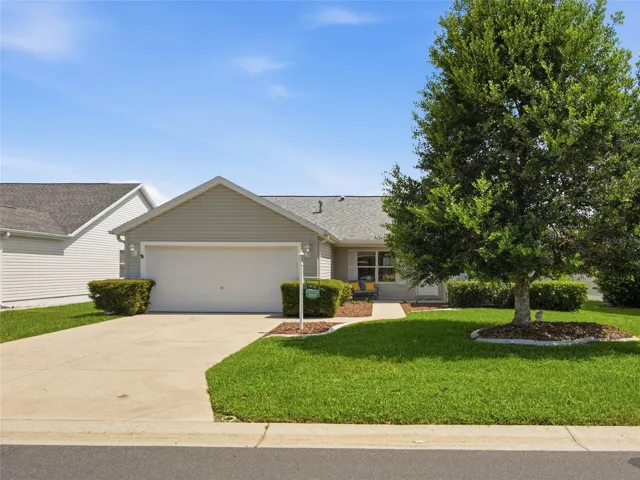 Street view. Mature landscapiing, front porch.