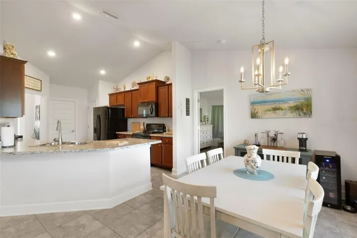 The kitchen boasts a wrap-around breakfast bar and closet pantry.