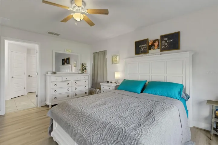 The spacious primary suite is nearby . . .