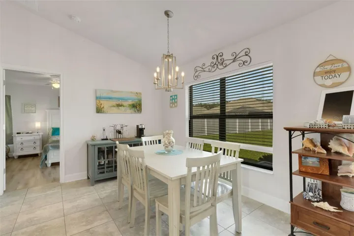 The dining space in integrated into the main living area and has lovely picture window overlooking the lush green backyard.