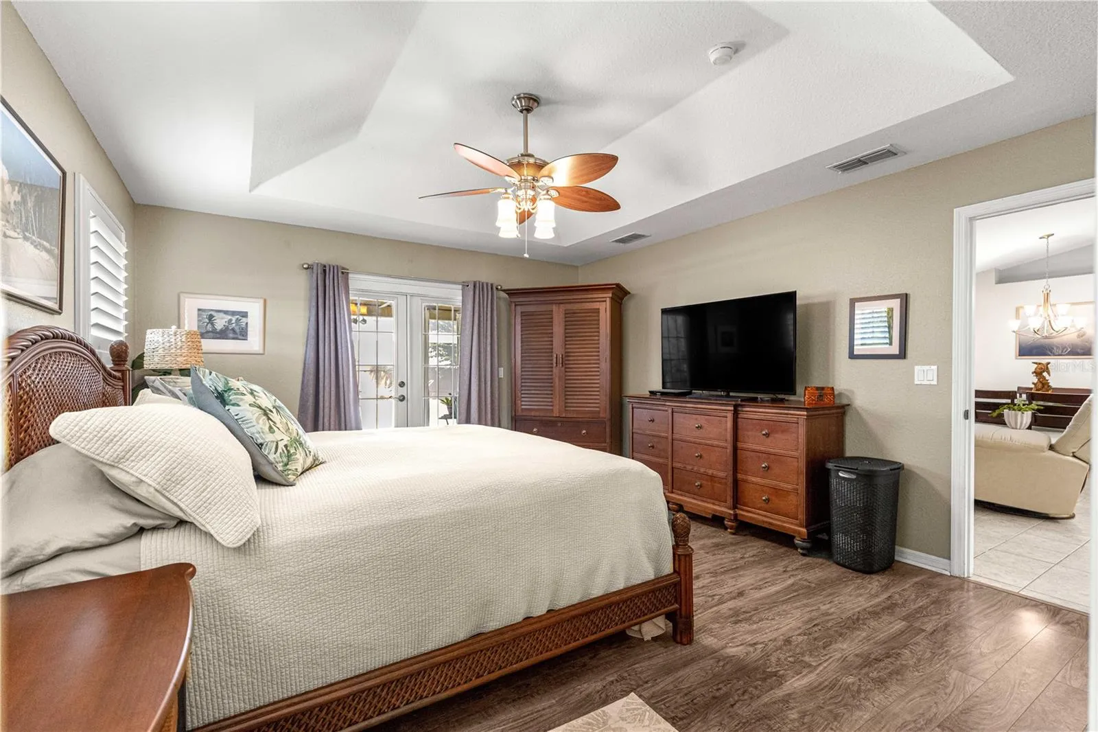 Primary bedroom with tray ceilings