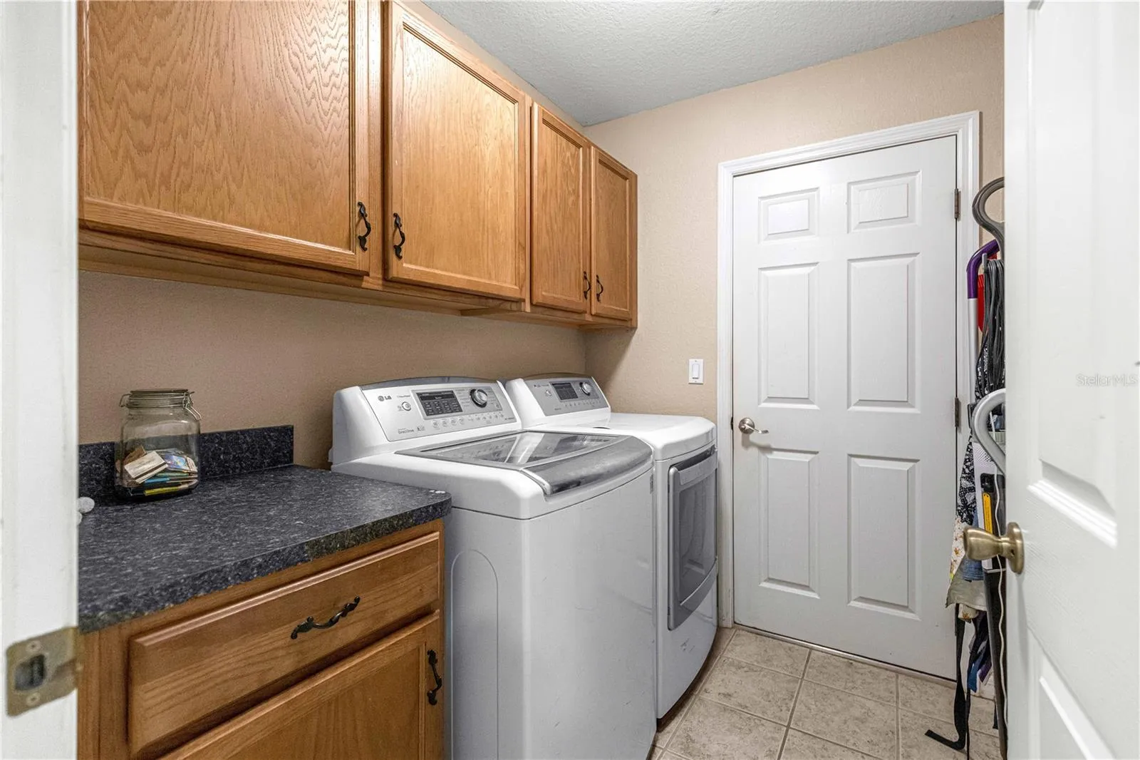 LG Washer and Dryer and storage cabinets