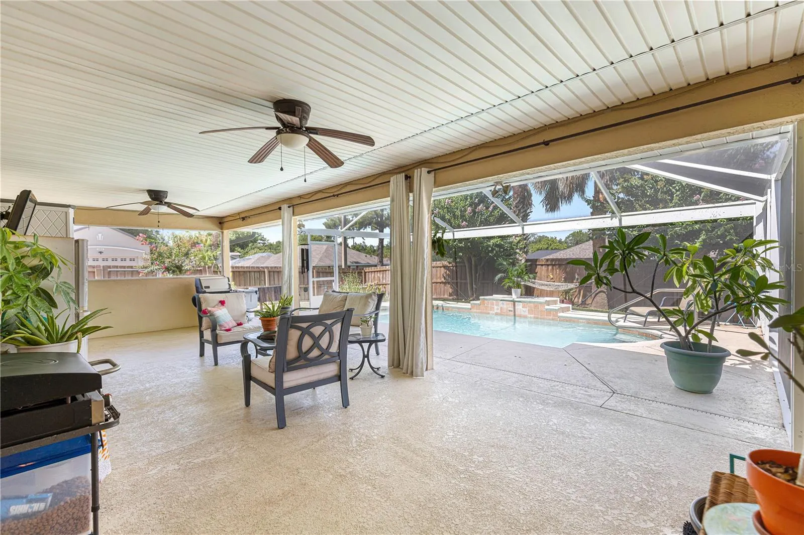Covered porch space with fans