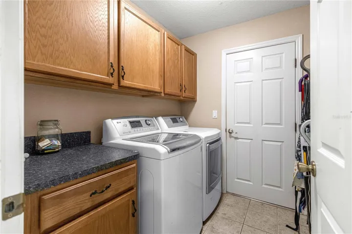 LG Washer and Dryer and storage cabinets
