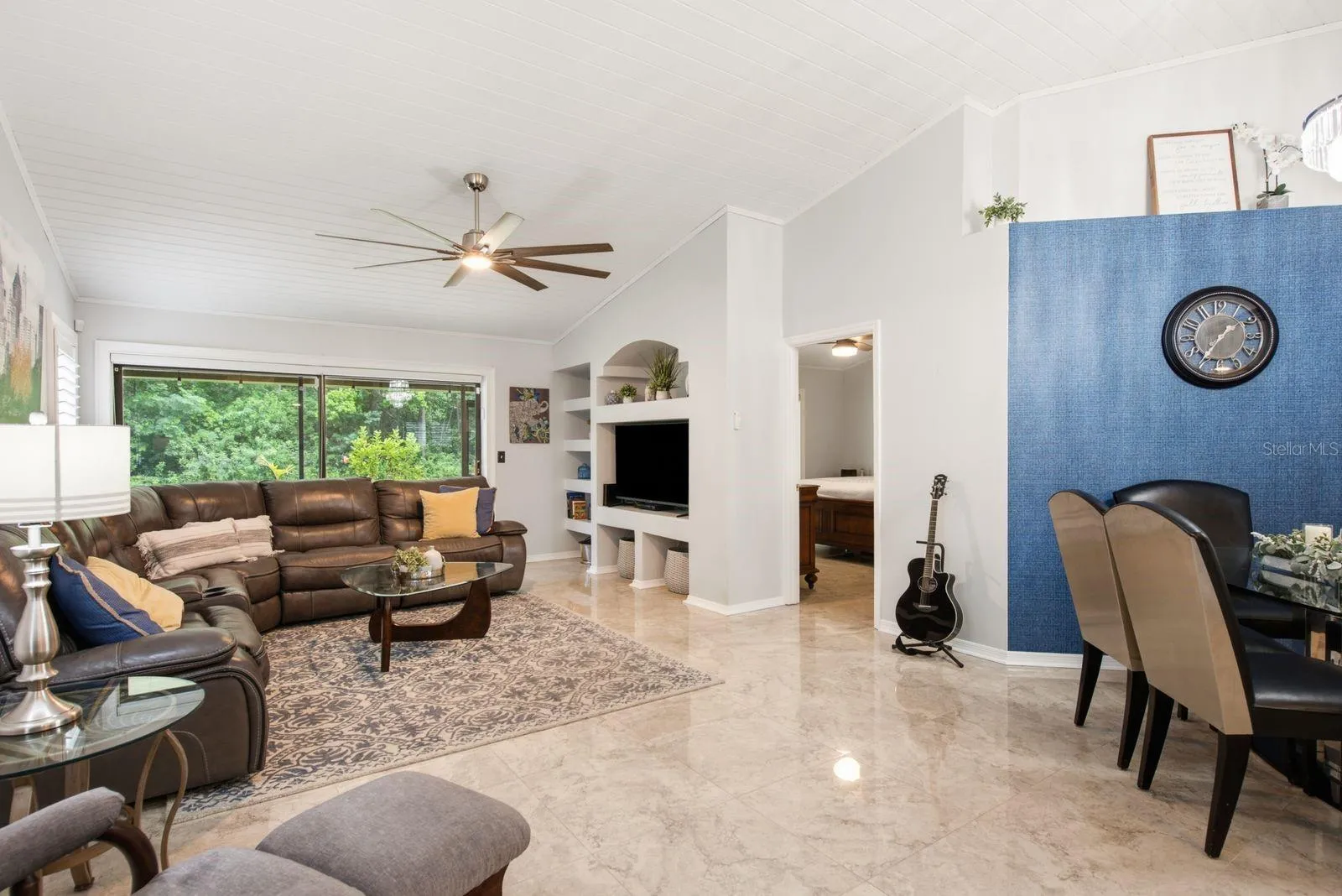 Family room - Stunning tile floors, sliding glass doors to a private patio