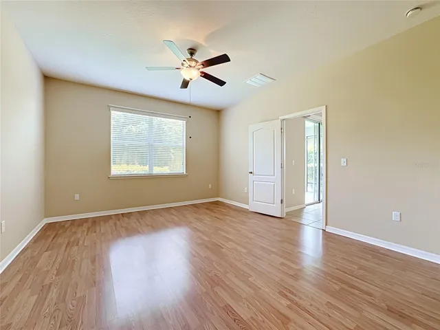 Primary bedroom with walk-in closet and en suite bathroom