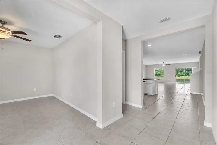 Just inside the front door is a flexible room providing endless possibilities as a home office, playroom, fitness area, or hobby space to suit your lifestyle.