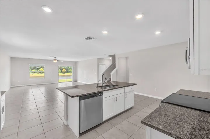 The kitchen, dining, and living room seamlessly flow together, creating the ideal gathering place for everyday living and special occasions.