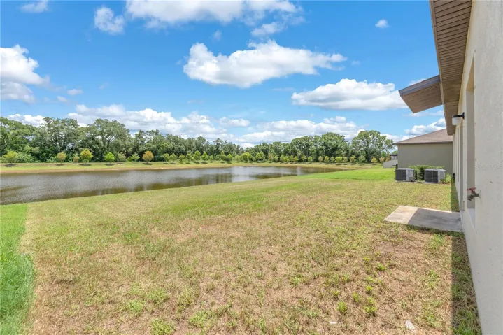 Situated on a homesite with a serene pond view, the expansive backyard offers endless opportunities to create your dream outdoor oasis.