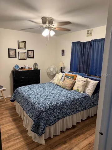 Secondary bedroom, ceiling fan, laminate flooring