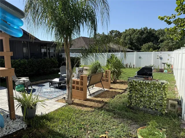 Large fenced backyard, paver patio and pool.