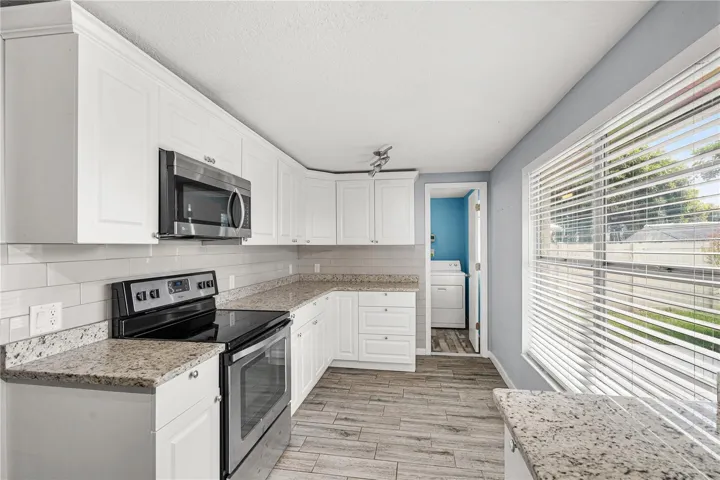 Kitchen with Granite Countertops and Stainless Steel Appliances