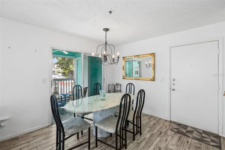 Dining room overlooking balcony & pool area