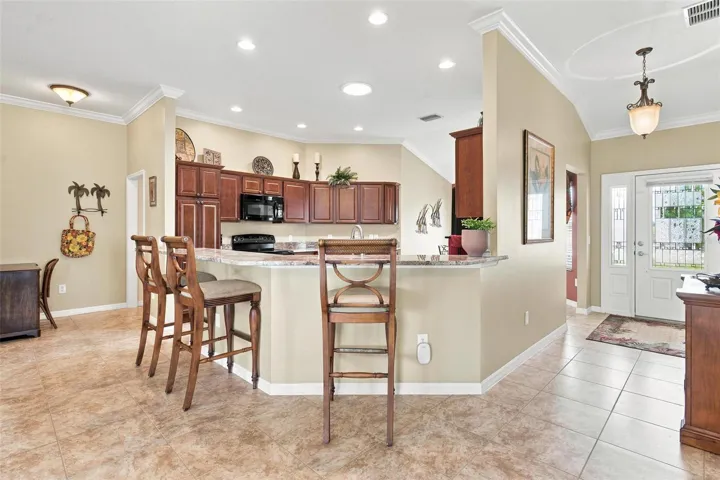 Open Floor Plan. Kitchen features granite countertops, solar tube to bring in natural light, while overlooking the dining and living area.