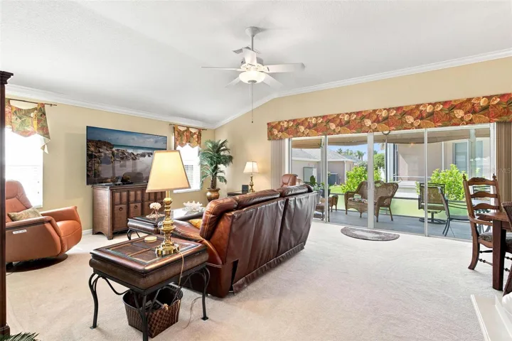 Living Room has sliders leading out to screen enclosed lanai.