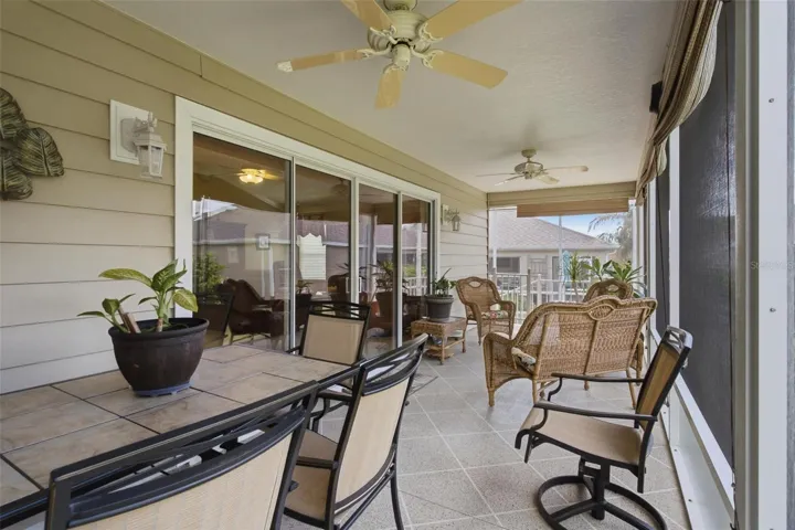 Screen enclosed lanai extends to almost the length of the back of the home.