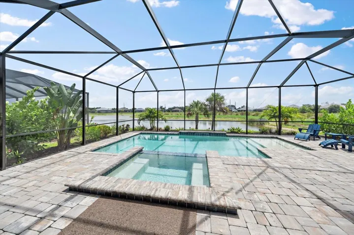 Stunning water view beyond your sparkling pool and lanai.