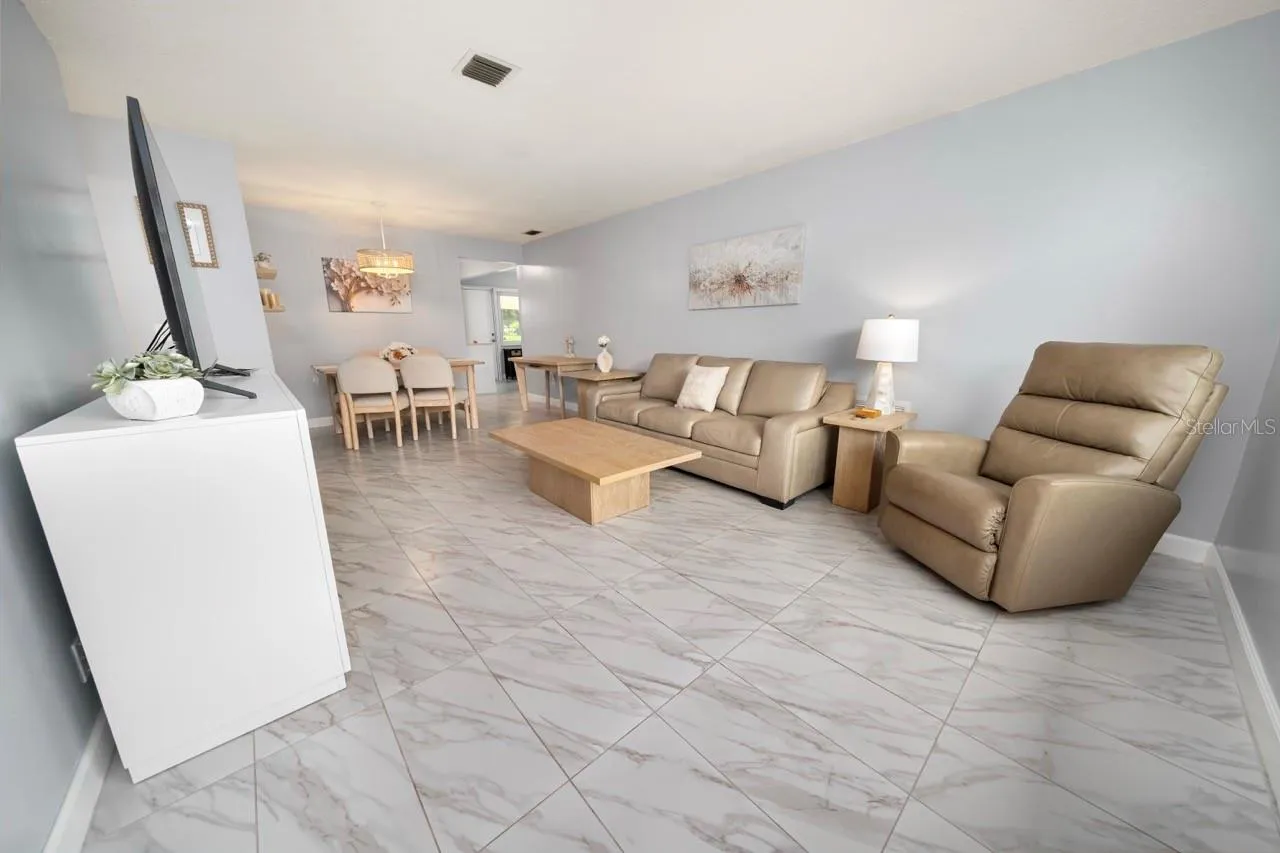 FAMILY ROOM. THIS VILLA STYLE CONDO IS PERFECT FOR ENTERTAINING FAMILY AND FRIENDS