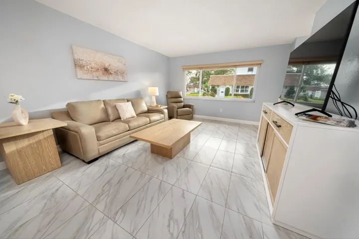 FAMILY ROOM. THIS VILLA STYLE CONDO IS PERFECT FOR ENTERTAINING FAMILY AND FRIENDS