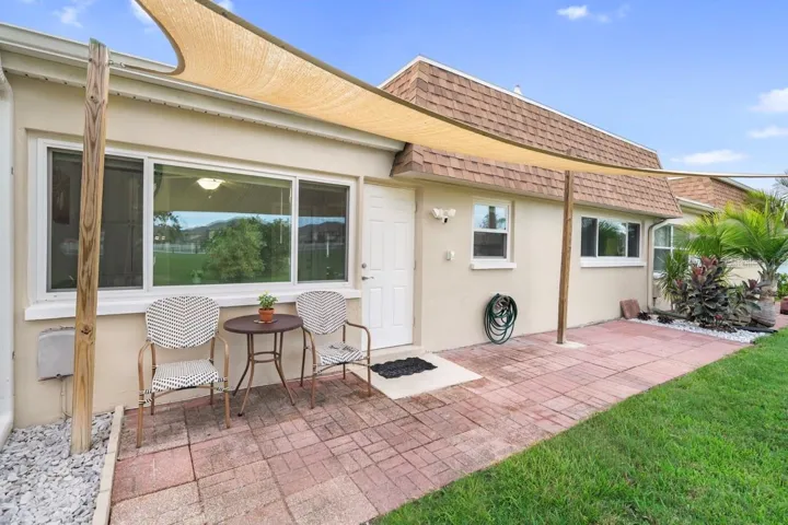 COVERED BACK PATIO & YARD.
