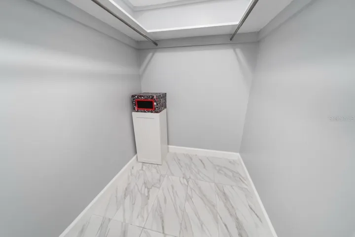 HALL CLOSET, STORAGE, ATTIC ACCESS. PREVIOUSLY GREAT GRANDKIDS PLAYROOM. IT'S THAT BIG. THERE IS ALSO A LINEN CLOSET IN THIS HALL.