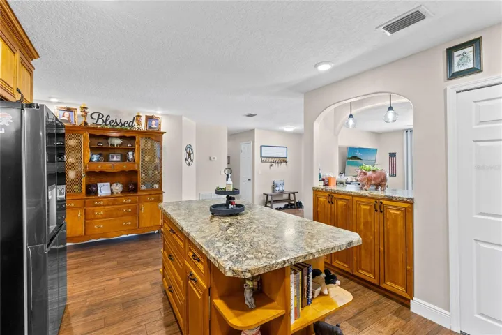 Kitchen with pass through window to living area