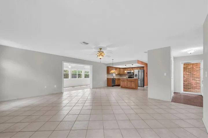 Living Room open to Kitchen and leading to Florida Room
