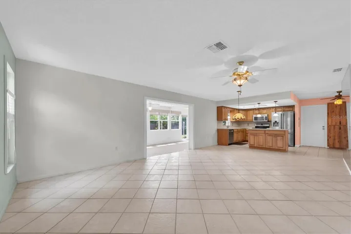 Open Floor Plan - Living, Dining and Kitchen leading to Florida Room