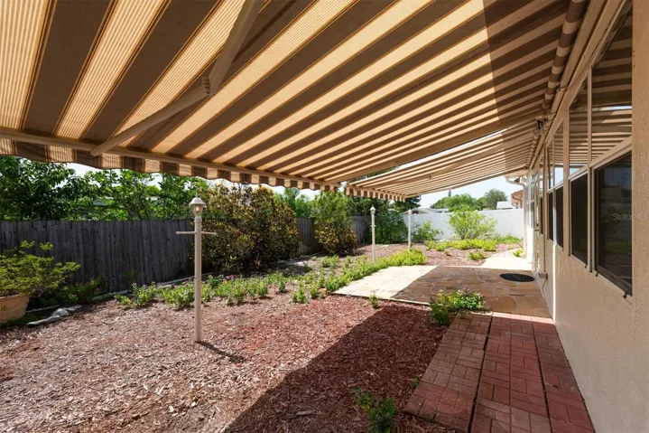 Back Patio with remote controlled Sun Shade Awnings - great for entertaining